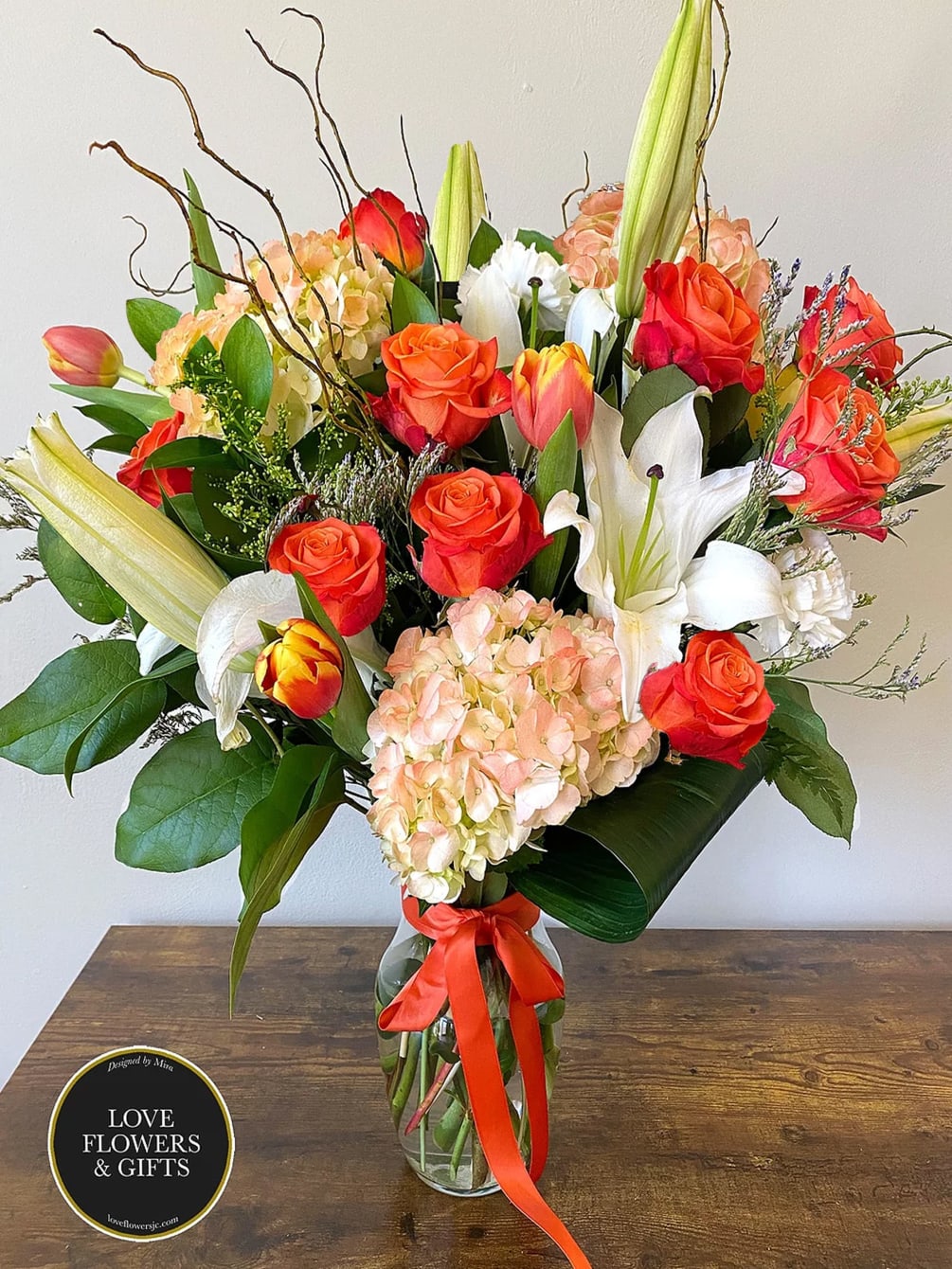 A beautiful, lush burst of vivid oranges&nbsp;and&nbsp;whites designed in a high-quality tall