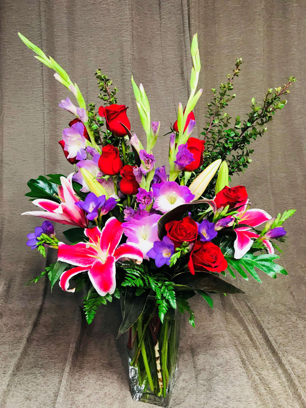 Gorgeous rich colors of assorted valentine flowers and 10 red roses in