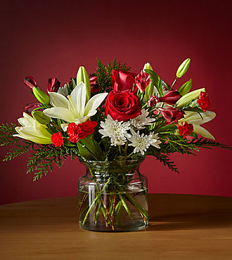 UPGRADED CLEAR VASE WITH WHITE LILIES, RED ROSES, RED ALSTROMERIA, WHITE MUMS
