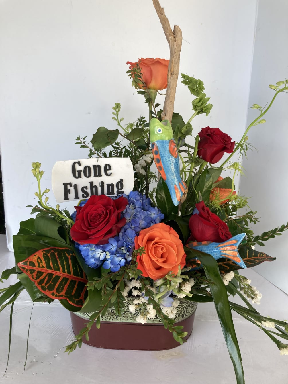 Personalized fishing theme with seasonal blooms