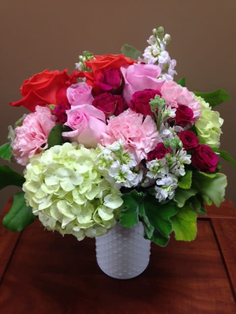 A sweet gift of pinks, whites, soft greens and whites designed in