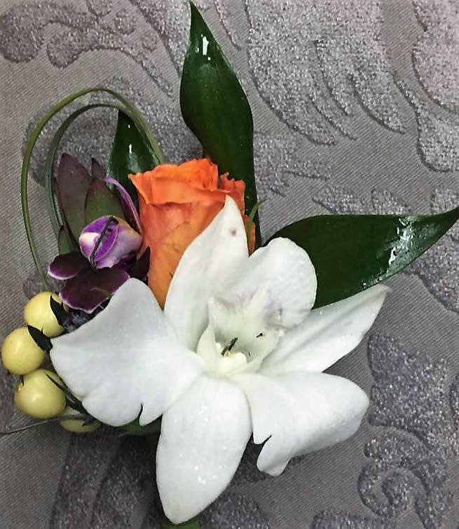 ORCHID BLOOMS ACCENTED WITH GREENS AND ANY COLOR ROSE.