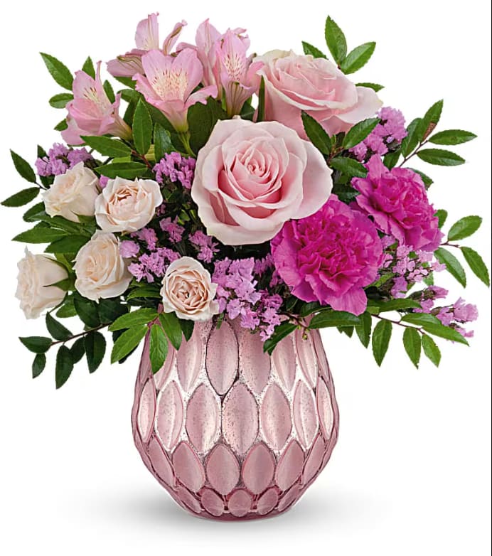 This arrangement features hot pink roses, light pink spray roses, dark pink