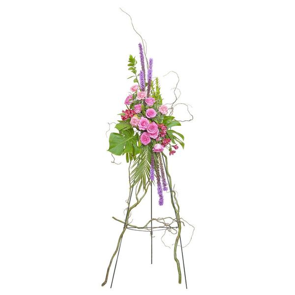 An beautiful pink easel spray including pink Roses and Willow with accents