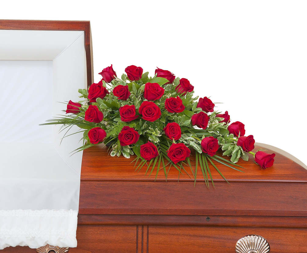 Two dozen Roses in a casket spray.