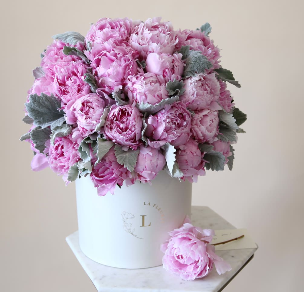 This gorgeous arrangement filled with the peonies and greens to deliver your