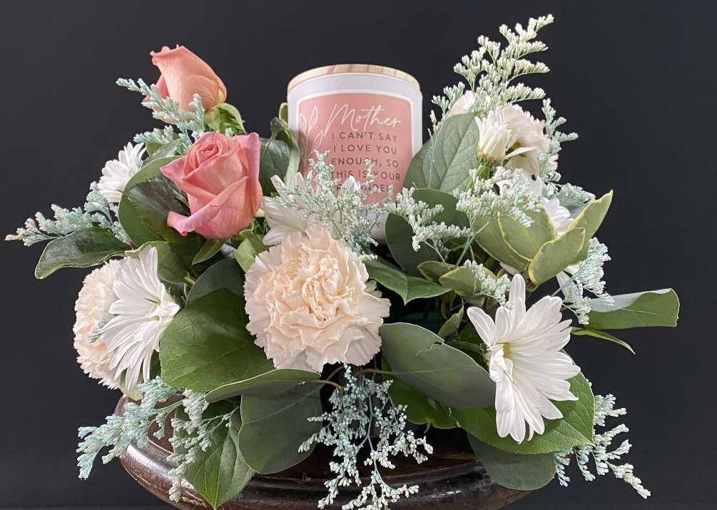 This candle and flowers arrangement is a lovely gift for a lovely