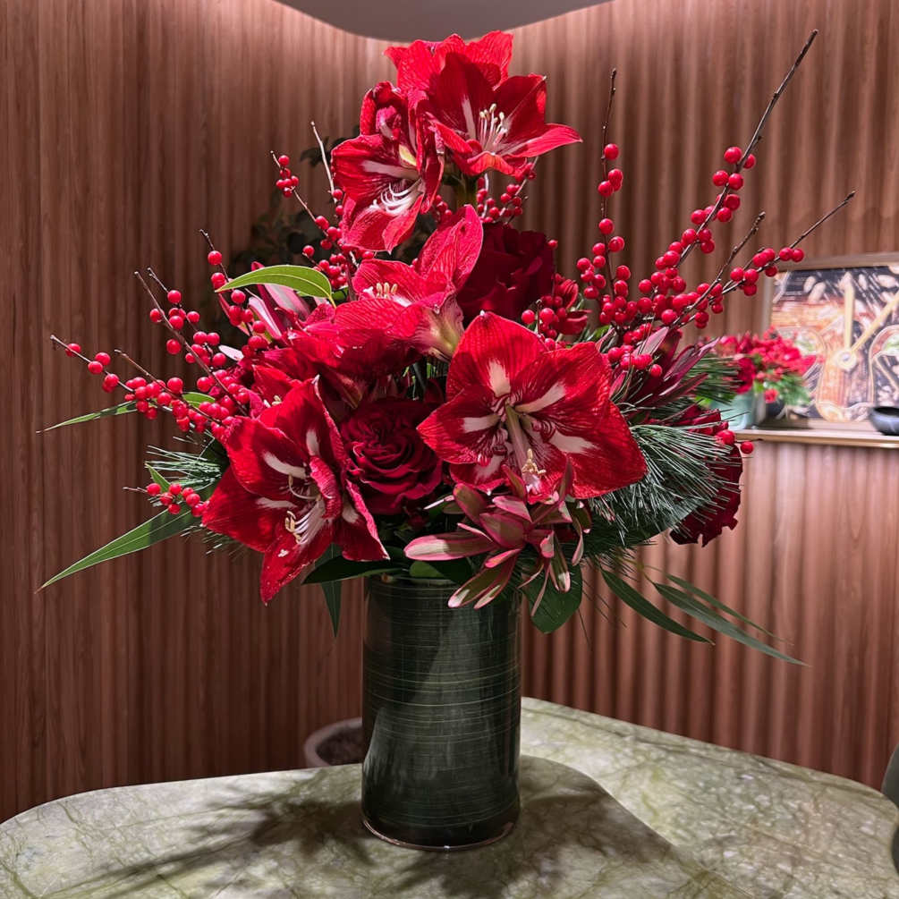 Amaryllis, Roses and Christmas Branches in a tall vase (included)
