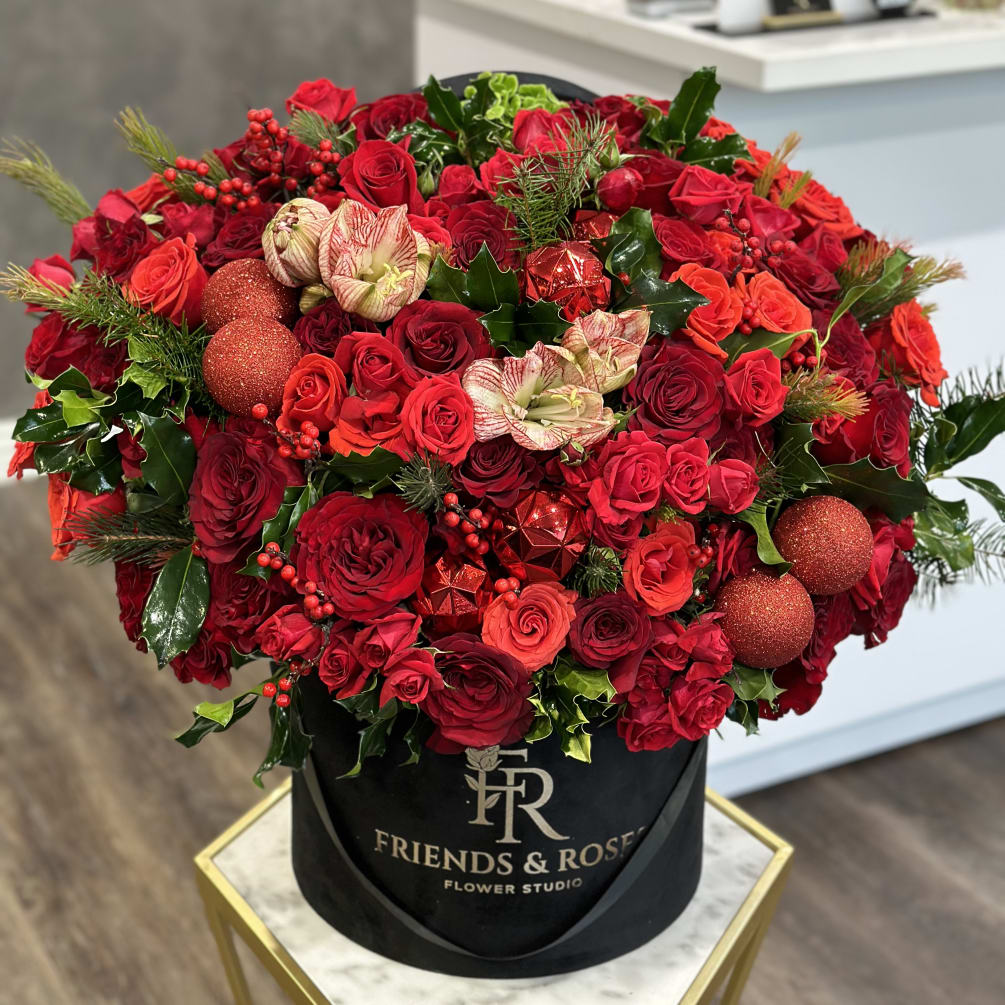 Stunning holiday arrangement in our signature large black box, filled with premium