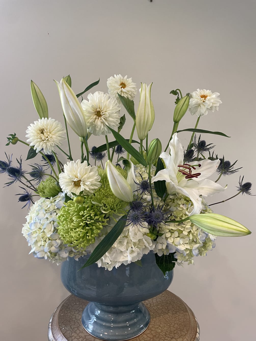 Blue hydrangeas, white lilies and dahlias 