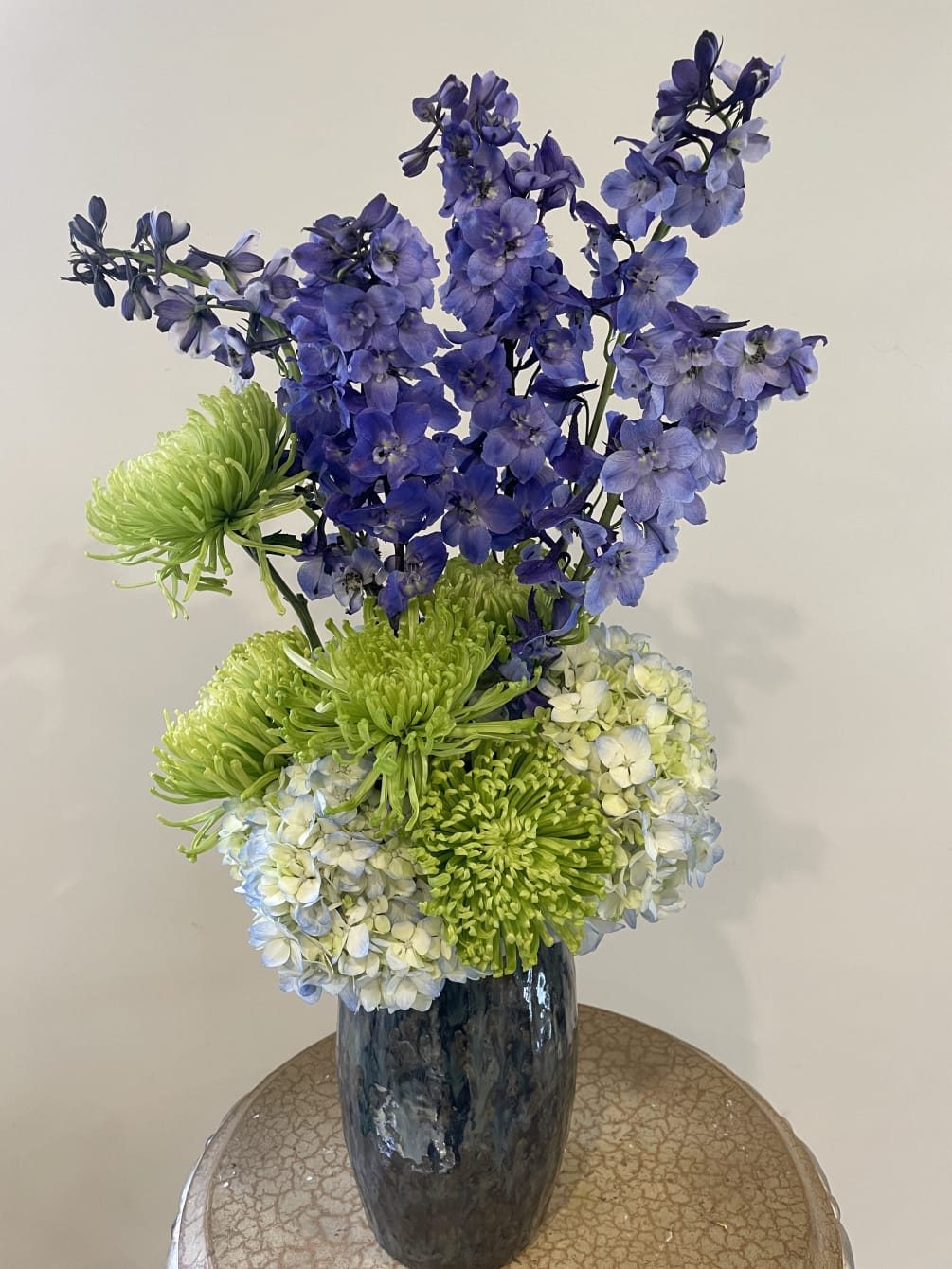 Blue hydrangeas, green chrysanthemums, purple delphinium