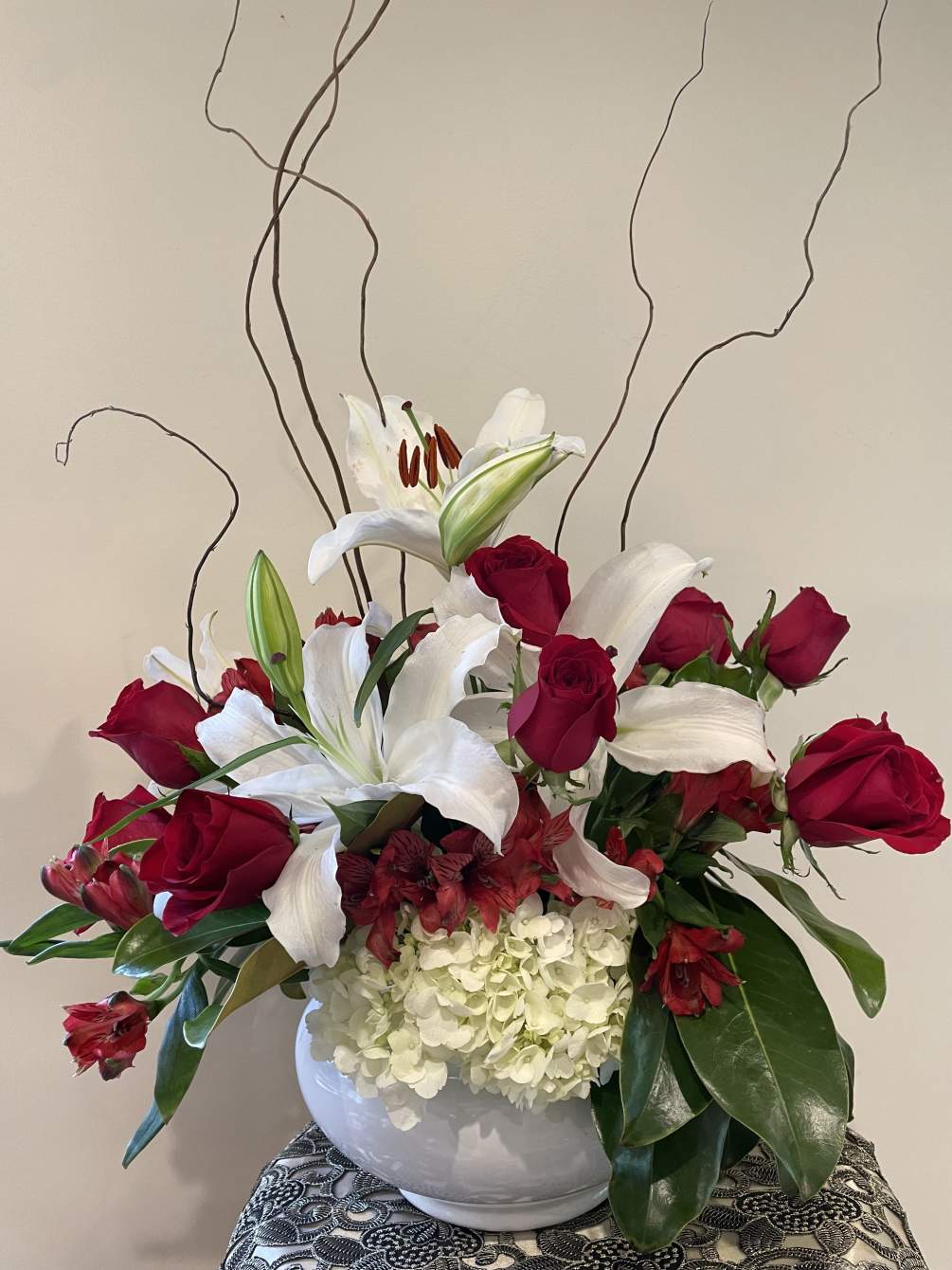 White hydrangeas, red roses, white lilies and alstromeria