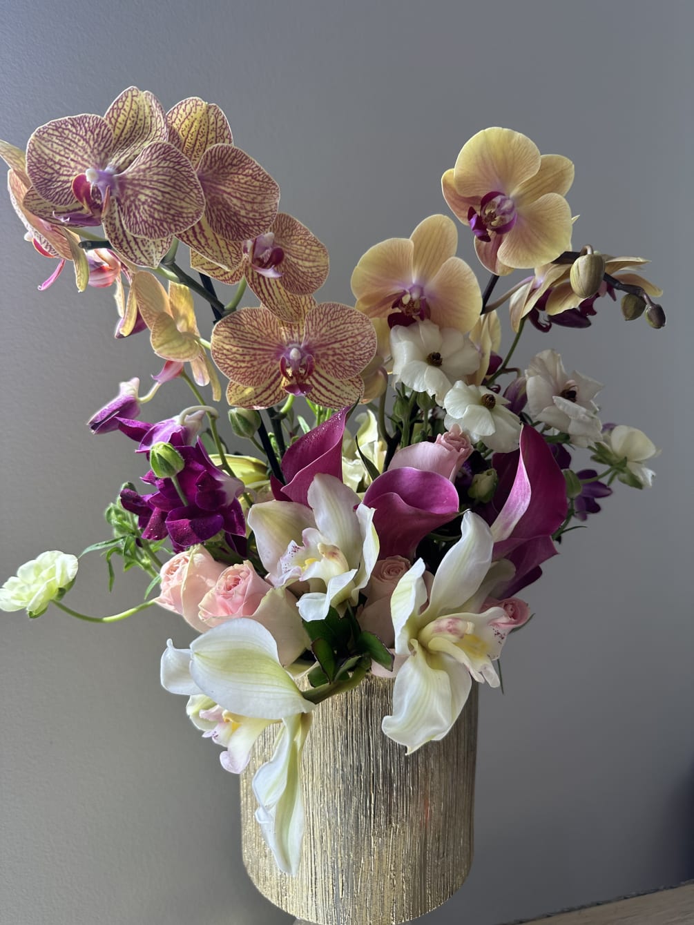 A gorgeous combination of Phalaenopsis Orchids mixed with Cymbidium orchids, purple 