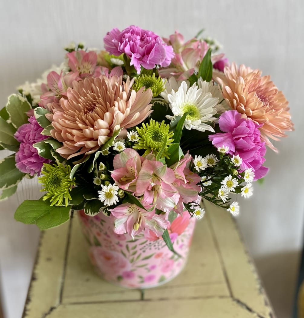 Such a pretty arrangement to brighten someone&#039;s day!
Decorative container will vary.