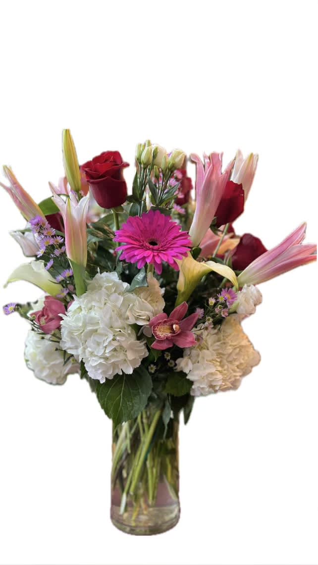 A lovely pink and white arrangement with fresh cut flowers ready to