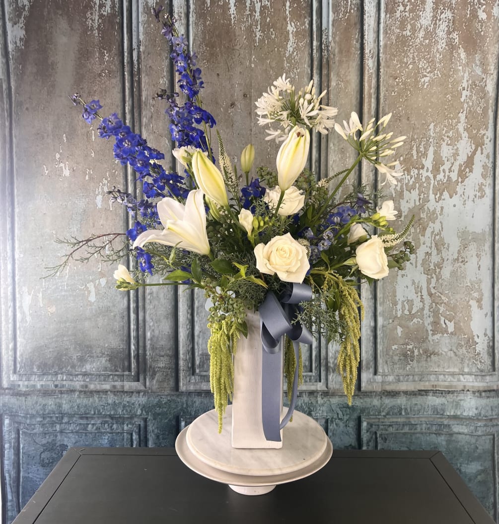 This stunning arrangement is sure to impress and is perfect for anyone