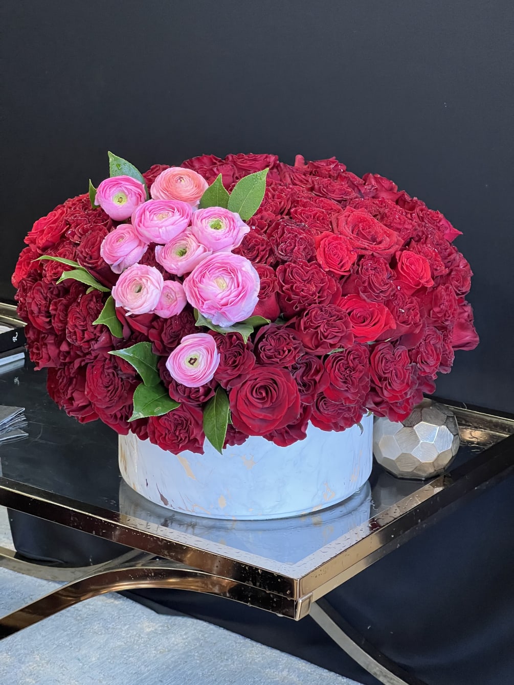 This stunning arrangement consists of only Red Roses &amp; Black Bacara Red