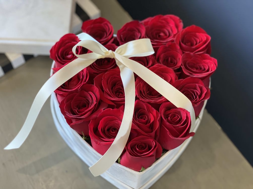 Heart-shaped box with 18 red roses 