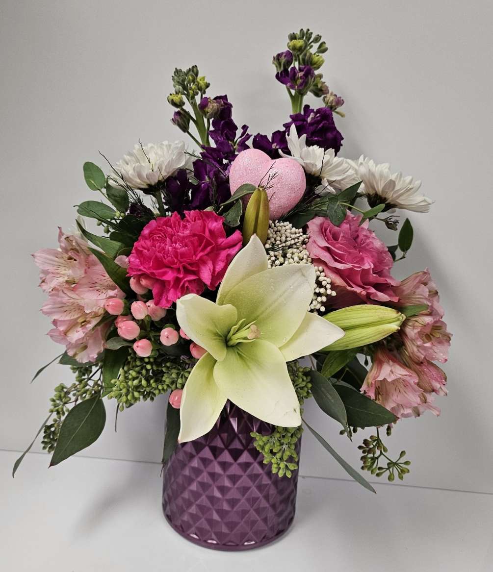 All the favorites in Diamond Cut Vase with Roses, Stock, Cushion Mums