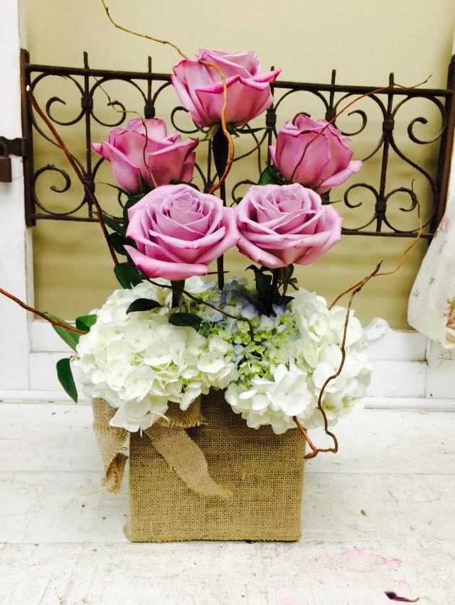 hydrangeas, roses in a burlap cube. Please specify color choice for roses