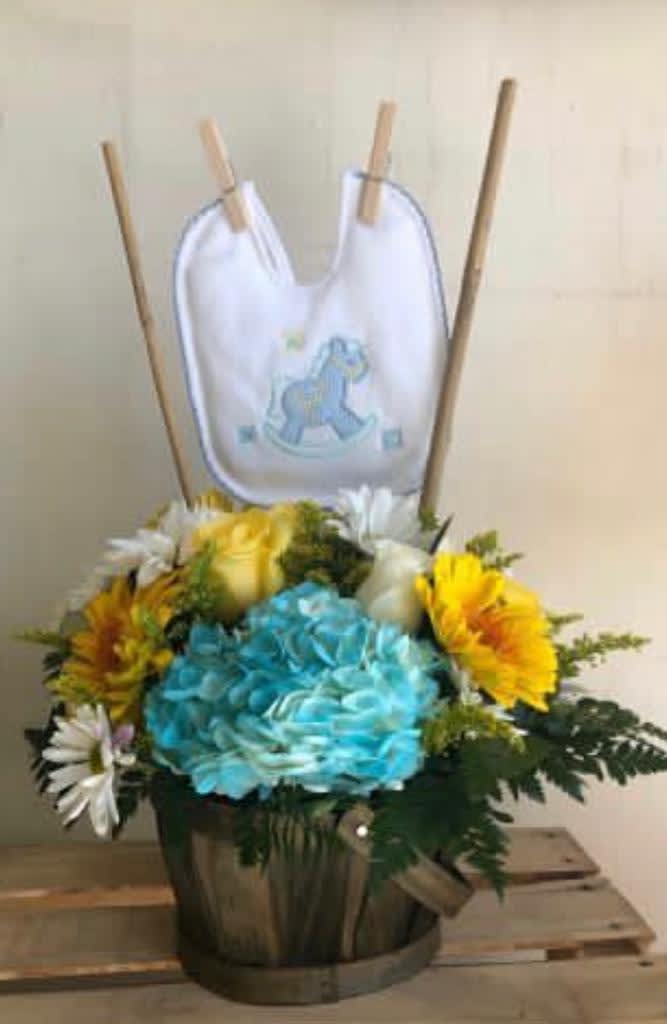 NICE BASKET WITH FLOWERS WITH A DETIL OF A BIB. VERY ORIGINAL