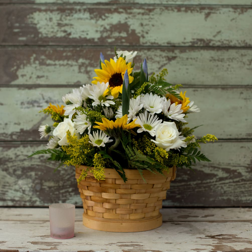 A bright, happy basket arrangement that will warm the heart of the