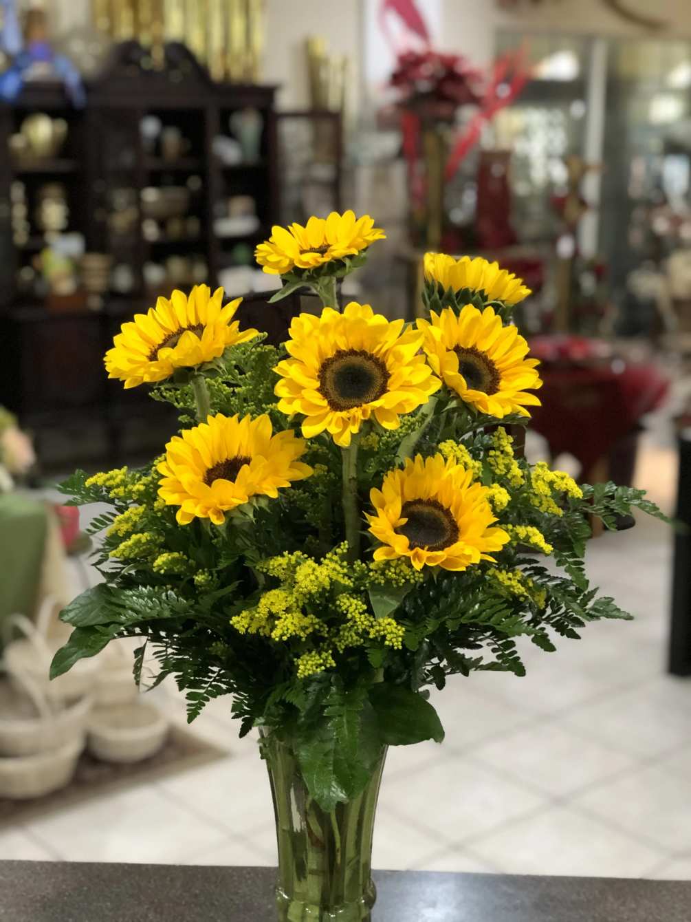 A beautiful vase of glorious sunflowers that is sure to do Vincent