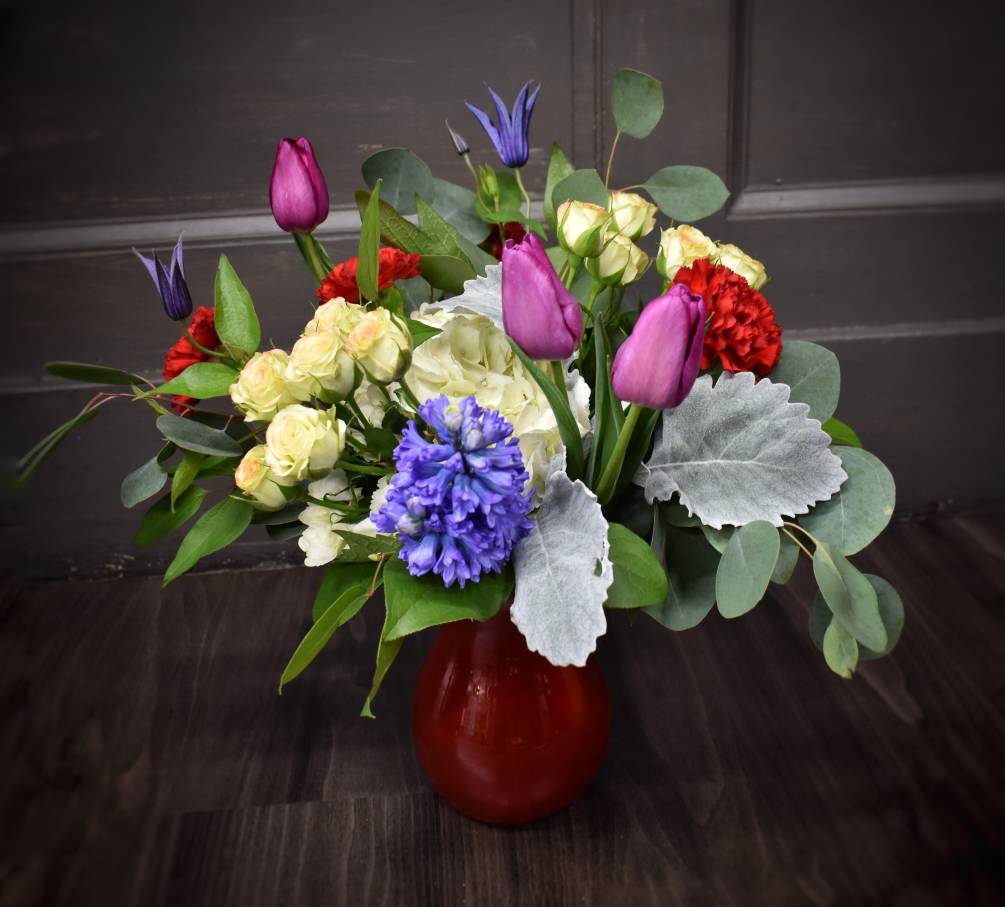 We love this colorful valentine bouquet! A bright red vase is filled