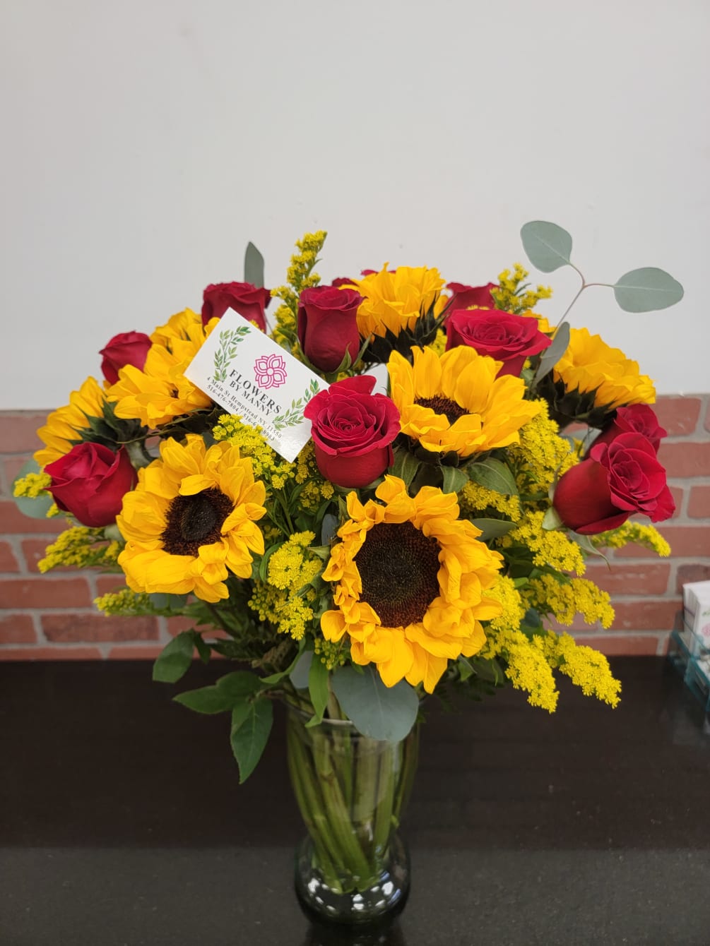 Overnight arrangement is a nice combination of 12 roses, 12 Sunflowers 6