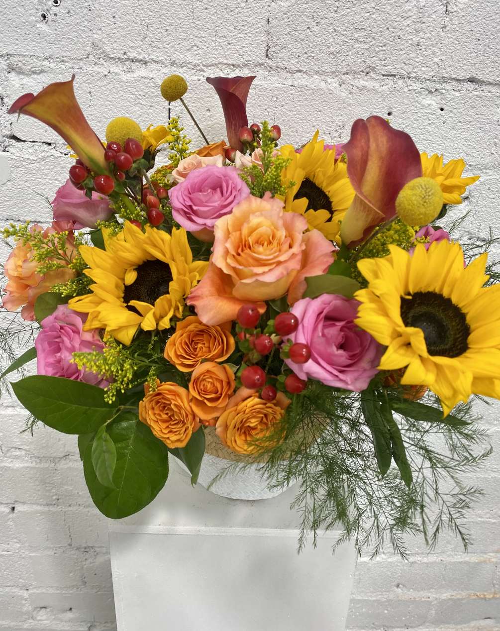 Tall and colorful flower arrangement that will brighten up your loved one.