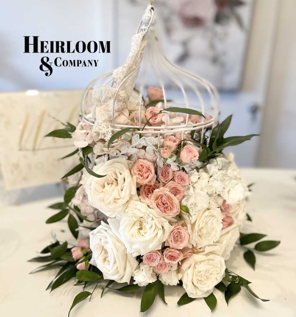 Inspired by the charm of shabby chic vintage aesthetics, this arrangement features
