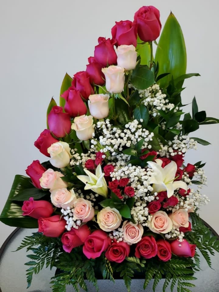 twenty four  roses combined with spray roses, lilies and baby bread

Flowers