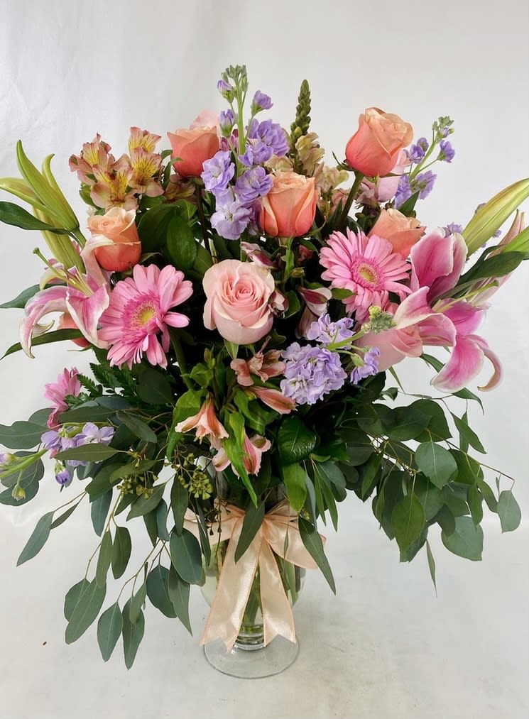 Tall and impressive flower arrangement, spring blooms in pastel colors in an