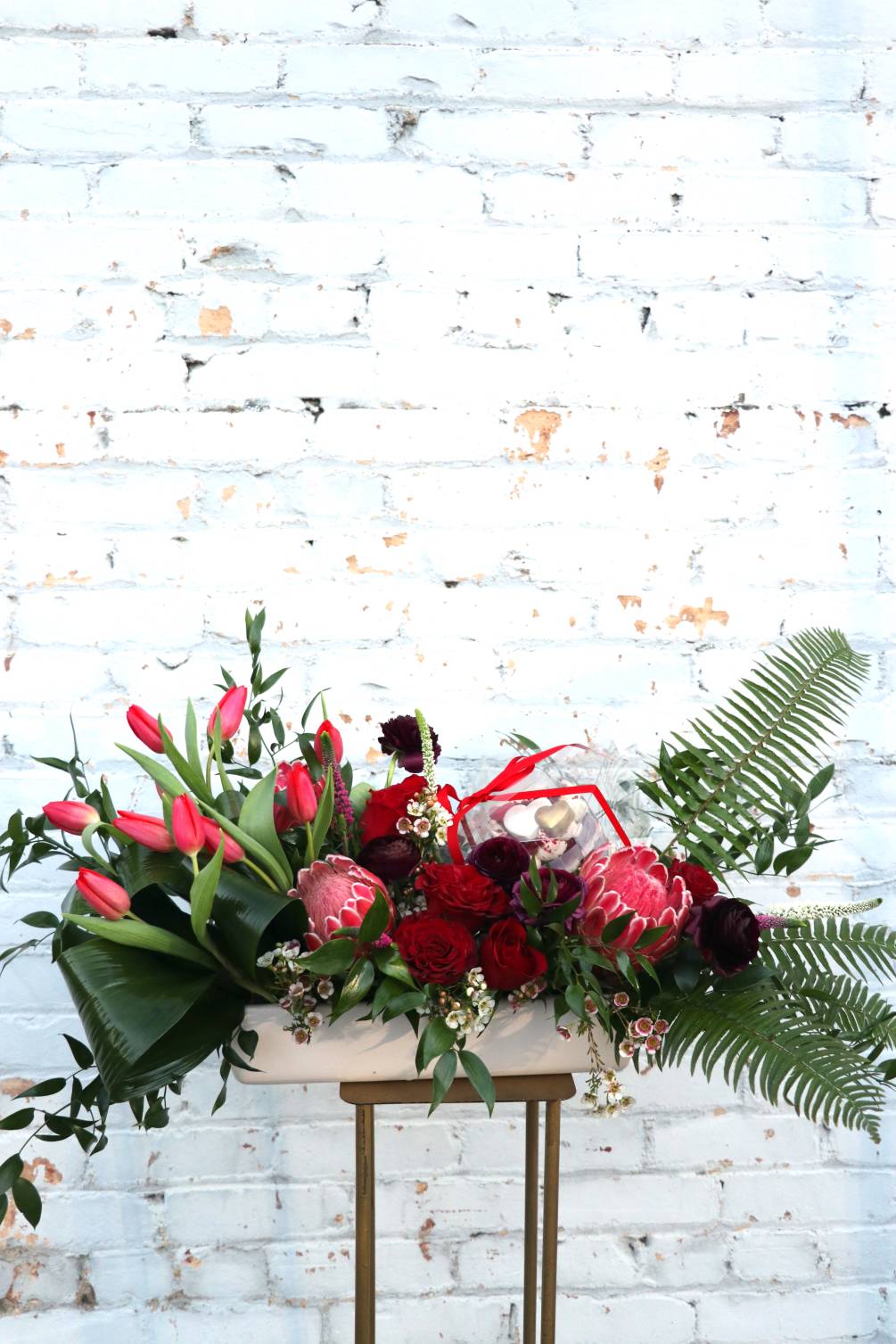Stunning floral arrangement paired with a gift of your choosing. Participating businesses