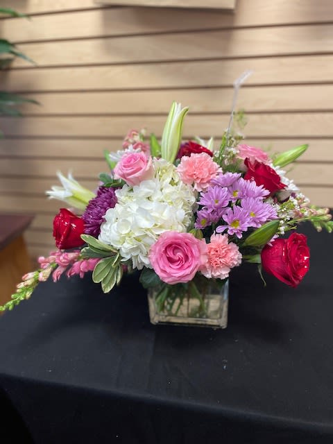 Mixed cut with red roses, pink roses, white hydrangea, lavender daisies, white