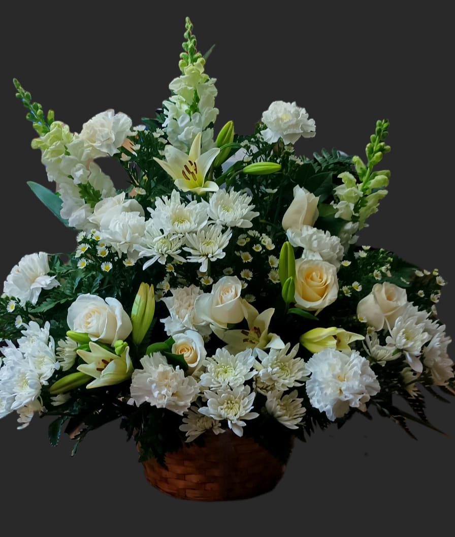 Very nice and big all white  funeral basket of flowers. For