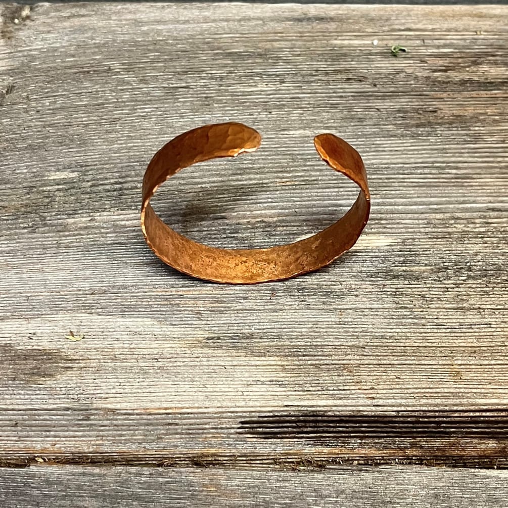 Hand-made copper bracelets from local artisan Chaz Lord. They come in a