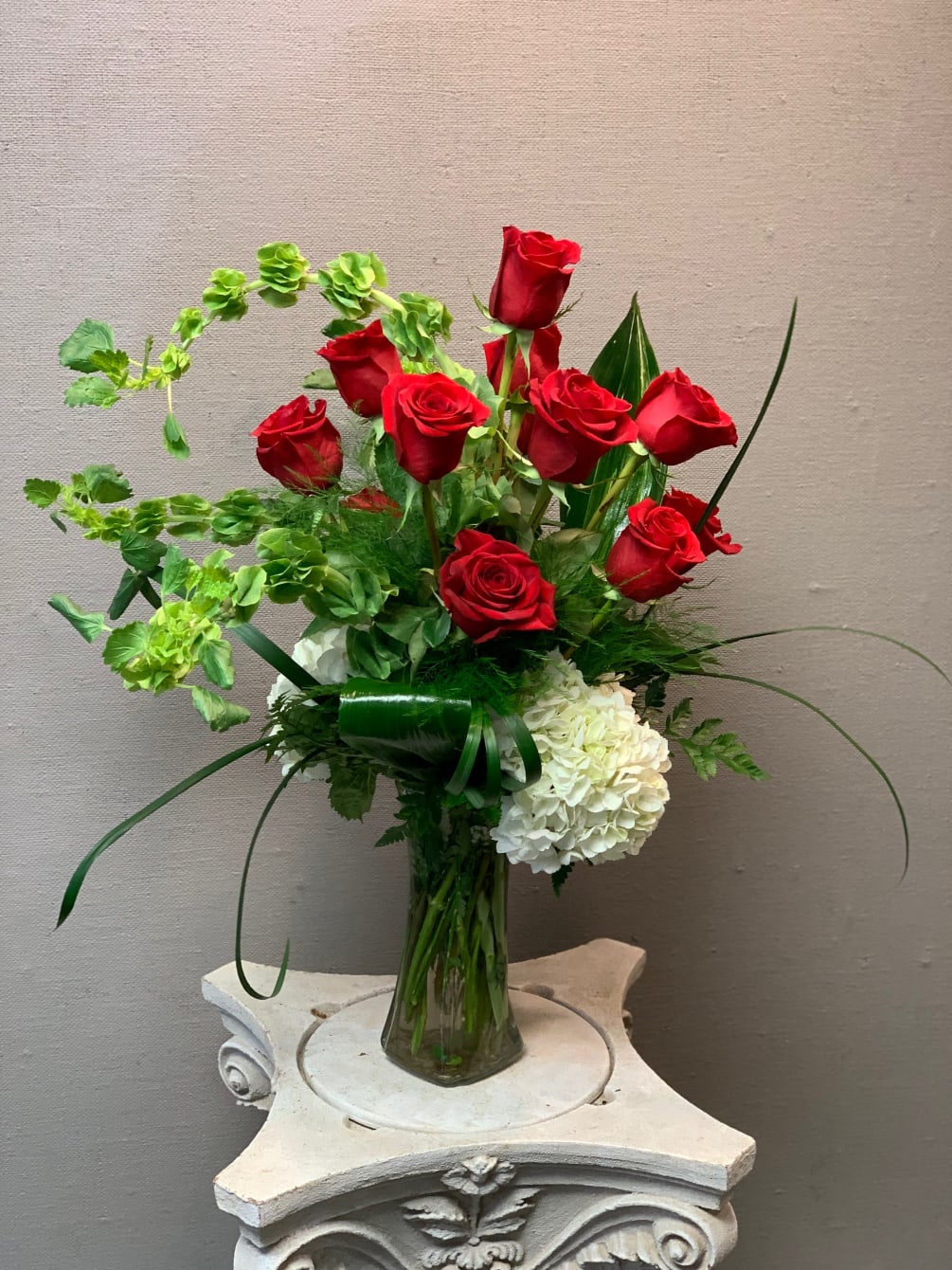 A new twist on a classic, timeless dozen red roses, with white