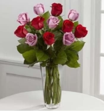Send your loved one six red roses and six lavender roses in