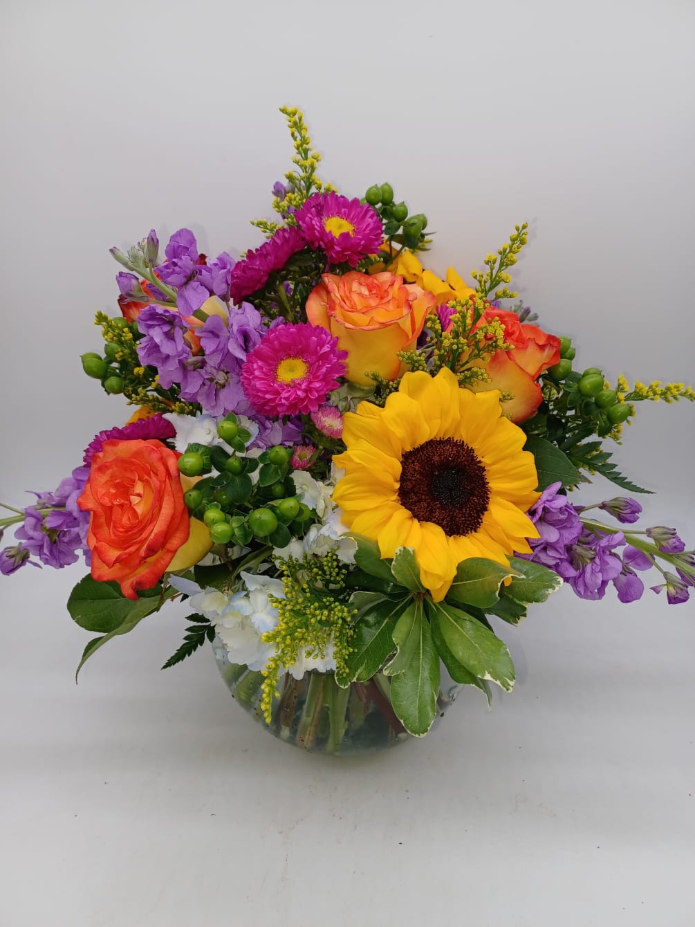 A bright and stunning mix of fresh blooms designed in a large