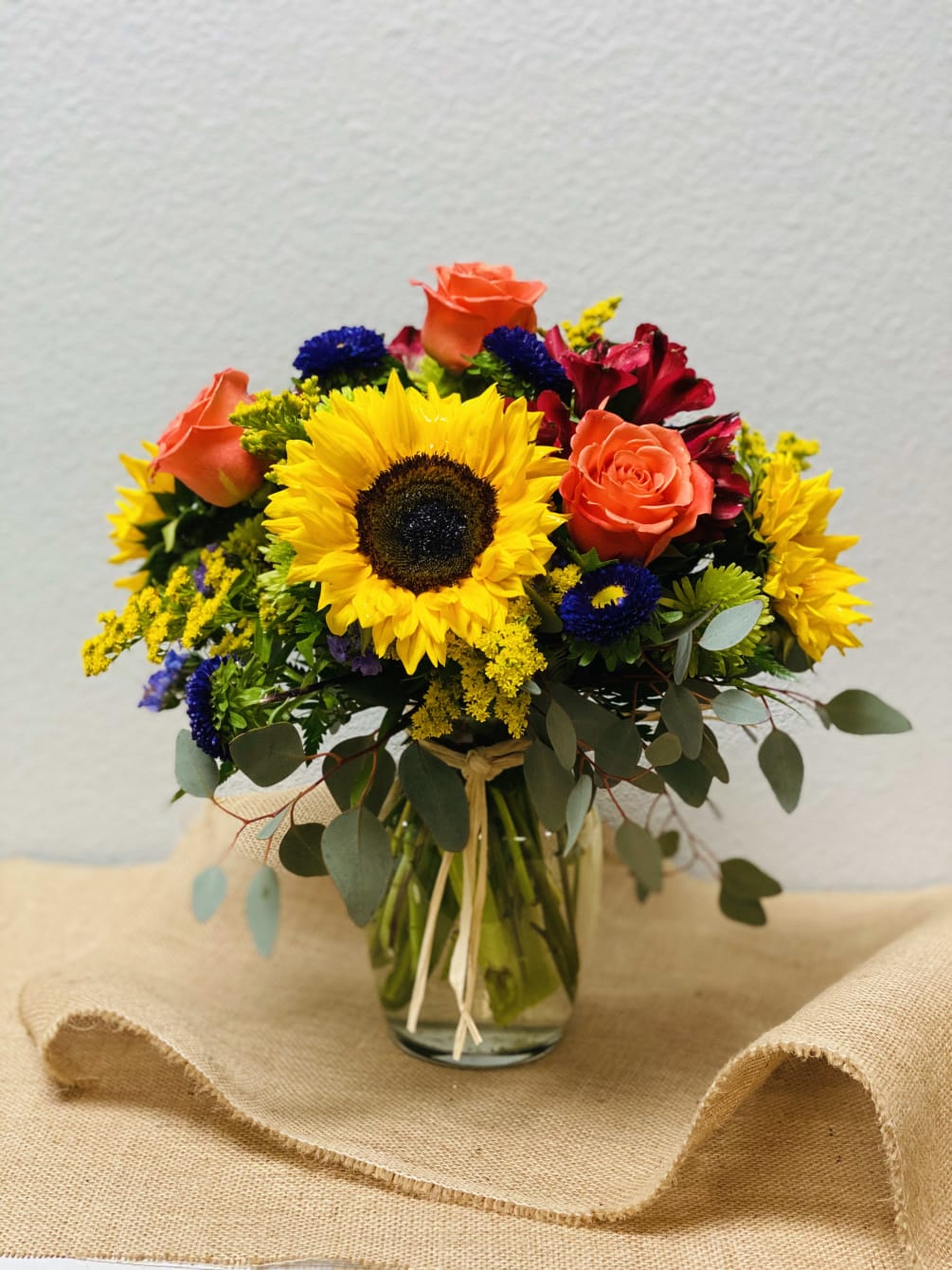 Beautiful arrangement of Roses and sunflowers.