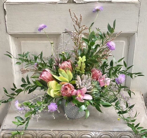 &quot;Whimsical Joy&quot; is a captivating flower arrangement that oozes delight and spontaneity.