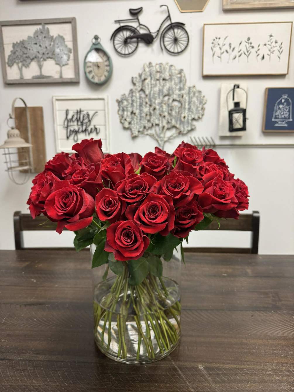50 Red Roses arranged in a clear vase.