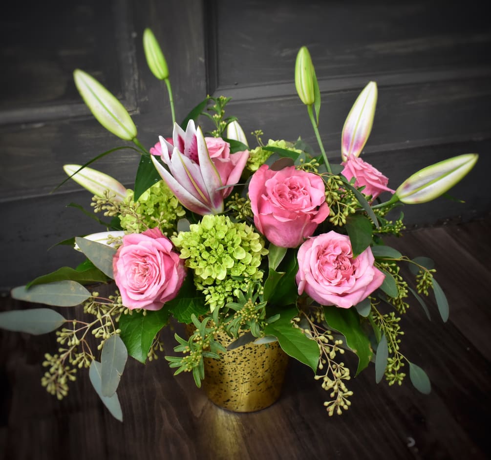 Fragrant lilies, 6 pink roses mini hydrangeas with foliages and accent flower.