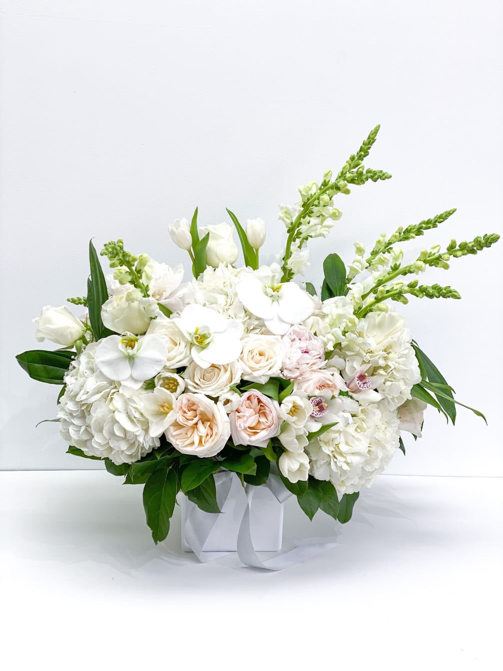 Enchantingly fragrant and delightfully beautiful, this garden roses arrangement is perfect for
