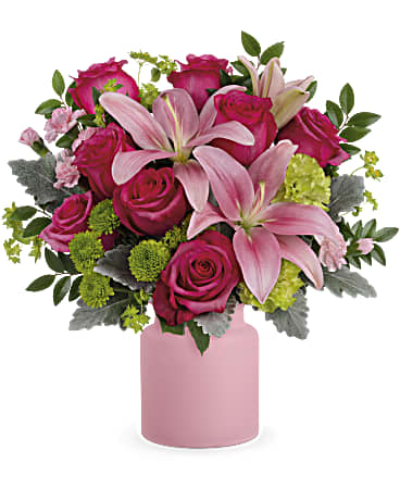 Hot pink lilies and roses delicately arranged