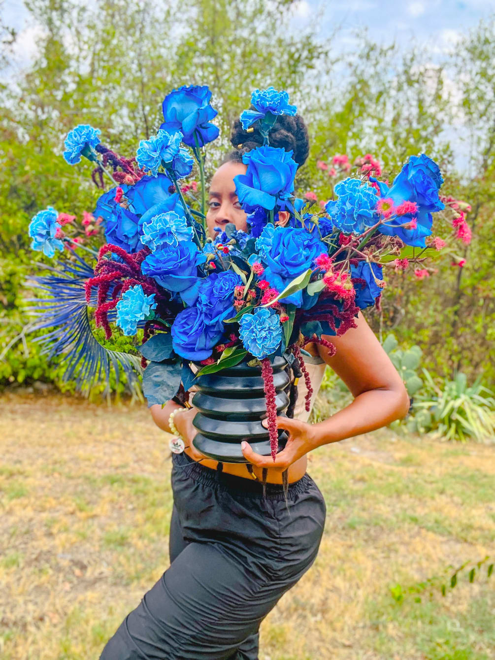 All blue blooms designed exotically in a premium vase.