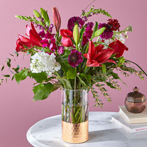 Entrance them with this charming arrangement of roses, carnations, Alstroemeria, Matsumoto Asters