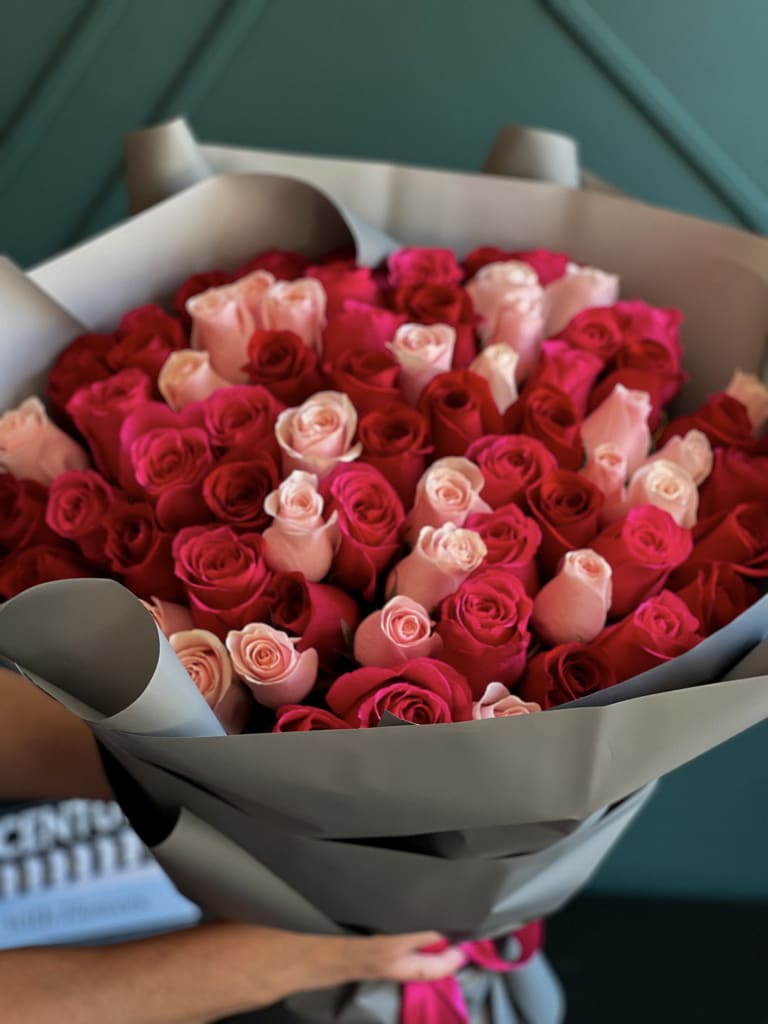 75 Mixed roses. Red, hot pink and pink . Hand-crafted bouquet in