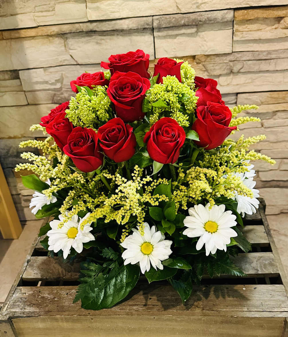 18 premium red roses with mini green hydrangeas arranged in a round